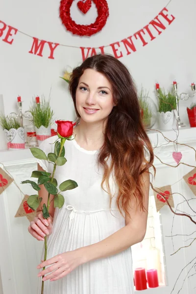 Girl holding red rose — Stock Photo, Image