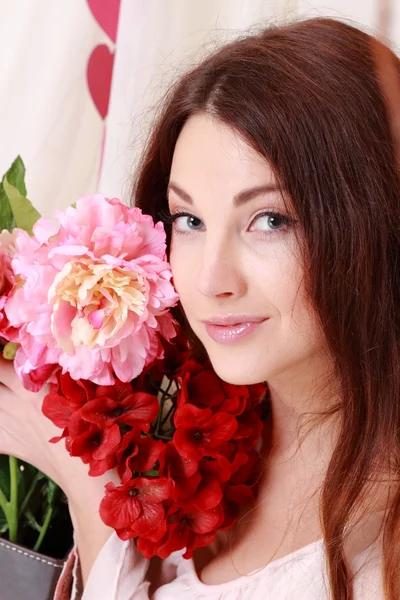 Young girl with flowers — Stock Photo, Image