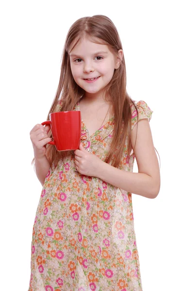 Mädchen mit roter Tasse — Stockfoto