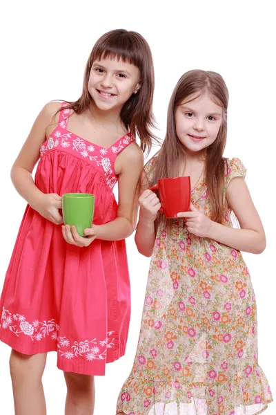 Girls with red and green cup — Stock Photo, Image