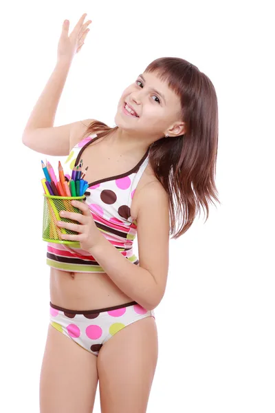 Little girl holding colorful pencils — Stock Photo, Image