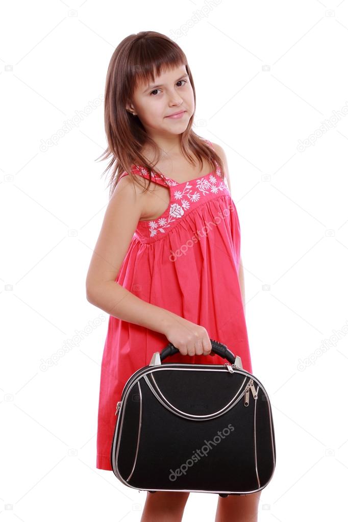 Girl holding travel baggage
