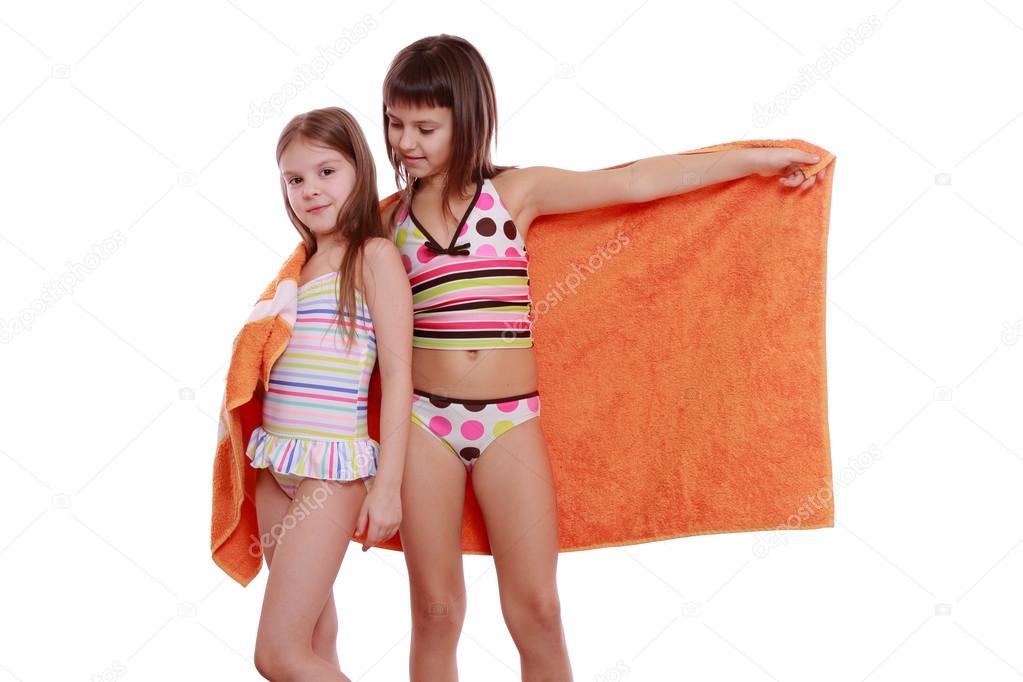 Girls holding towel Stock Photo by ©Mari1Photo 41907417