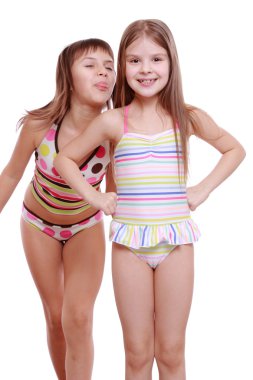 Little girls wearing summer swimsuits