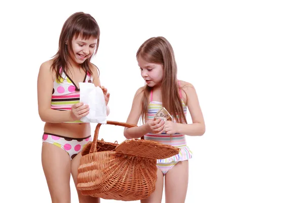 Girls with basket on white — Stock Photo, Image