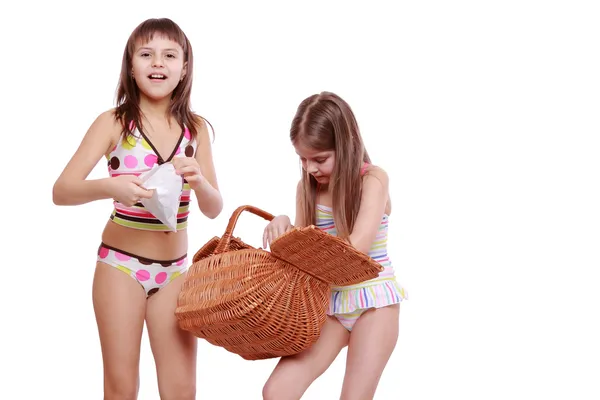 Girls with basket on white — Stock Photo, Image