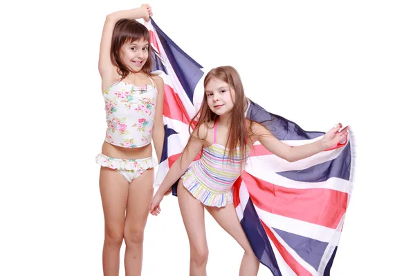 Flickor i baddräkt med brittiska flaggan — Stockfoto
