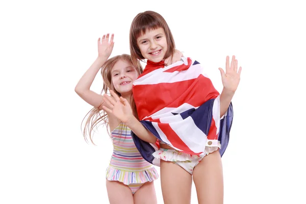 Kızlar mayo İngiliz bayrağı tutarak — Stok fotoğraf