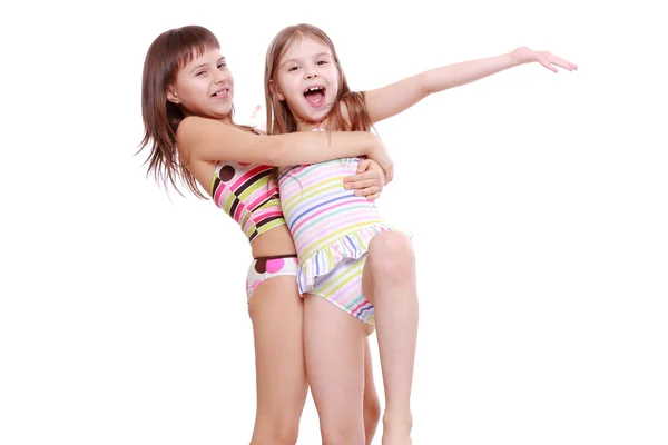 Little girls in a swimsuit Stock Image