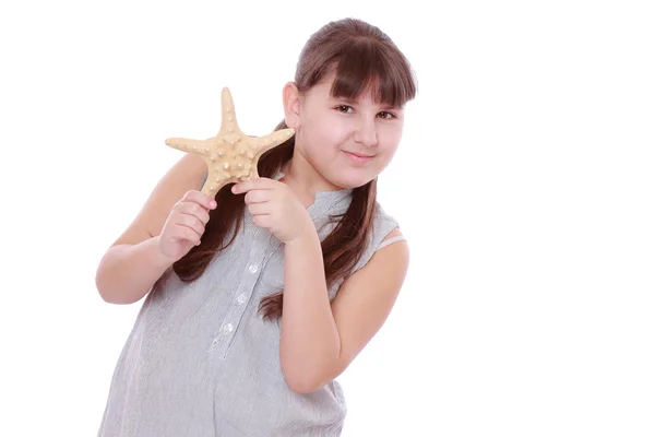 Girl holding starfish — Stock Photo, Image