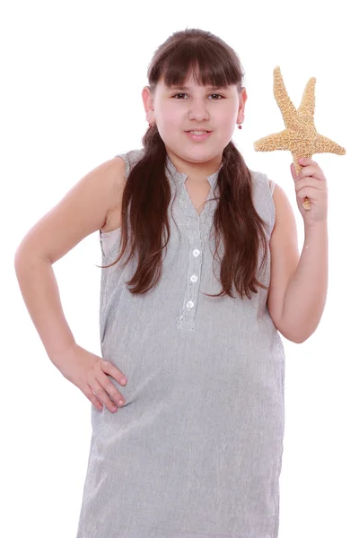 Girl holding starfish — Stock Photo, Image