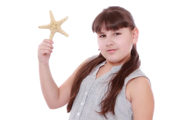 Niña Sosteniendo Estrella Peces Sobre Fondo Blanco —  Fotos de Stock