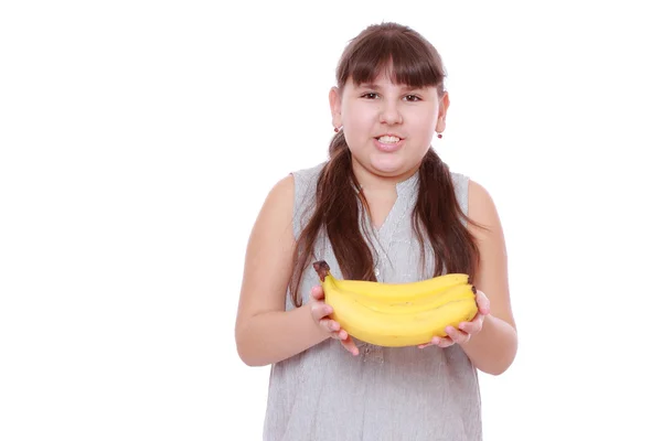 Dívka hospodářství banány — Stock fotografie