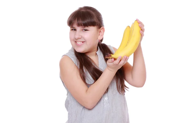 Girl holding bananas — Stock Photo, Image