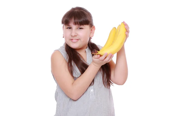 Niña Sosteniendo Plátanos Amarillos Sobre Blanco —  Fotos de Stock