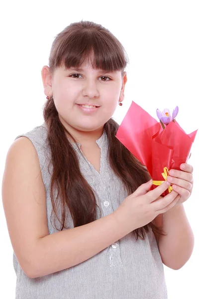 Girl holding a crocus — Stock Photo, Image