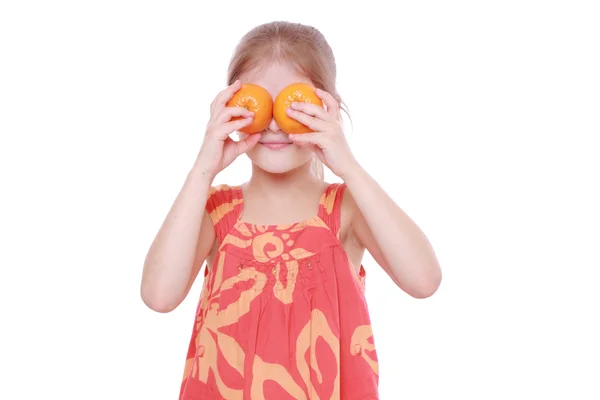 Girl holding mandarins — Stock Photo, Image