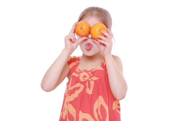 Girl holding mandarins — Stock Photo, Image