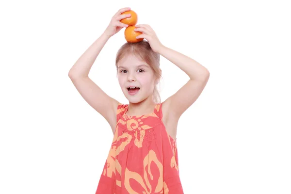 Girl holding mandarins — Stock Photo, Image