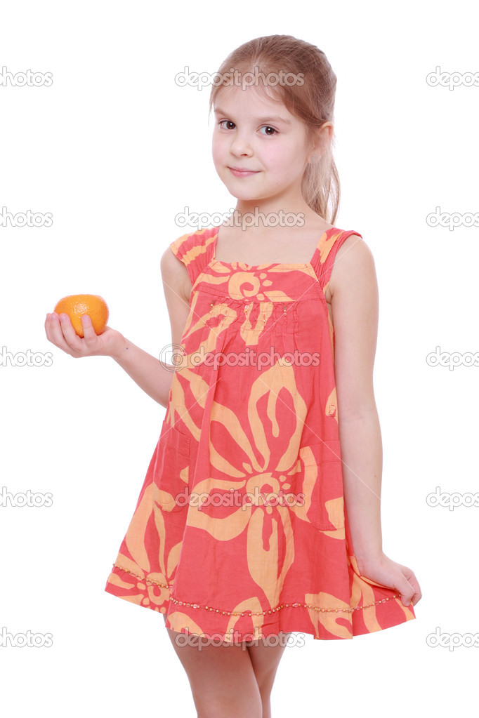 Girl holding mandarin