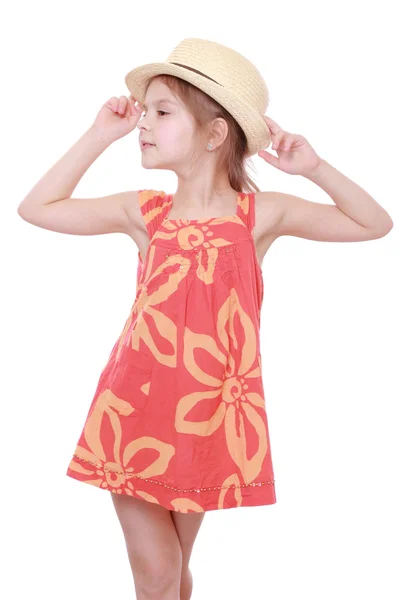 Girl in summer dress and straw hat — Stock Photo, Image