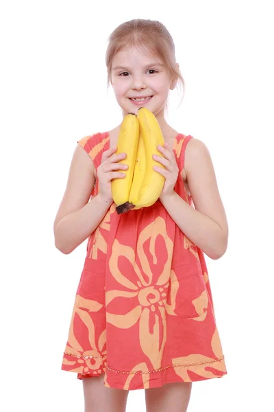 Girl holding yellow bananas — Stock Photo, Image