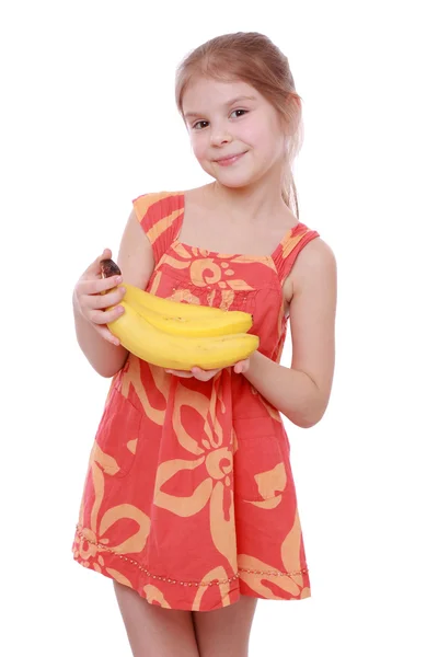 Dívka hospodářství žluté banány — Stock fotografie