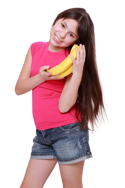 Sonriente Niña Alegre Sosteniendo Plátanos Amarillos —  Fotos de Stock