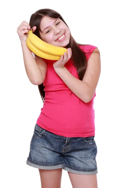 Sonriente Niña Alegre Sosteniendo Plátanos Amarillos — Foto de Stock