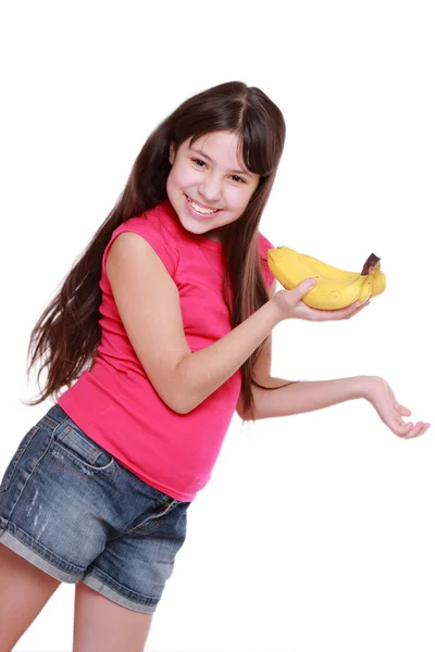 Dívka hospodářství žluté banány — Stock fotografie