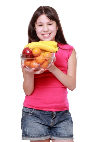 Girl holding fruit bowl — Stock Photo, Image