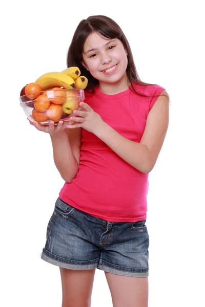 Girl holding fruit bowl — Stock Photo, Image