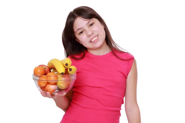 Girl holding fruit bowl — Stock Photo, Image