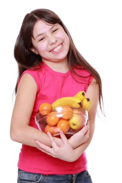 Girl holding fruit bowl — Stock Photo, Image