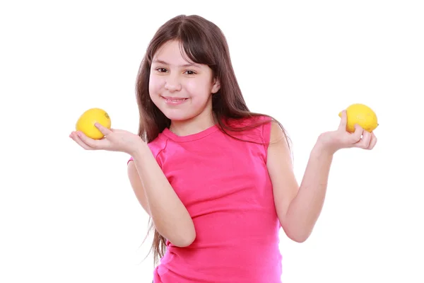 Girl with fresh yellow lemons — Stock Photo, Image