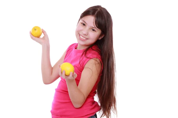 Girl with fresh yellow lemons — Stock Photo, Image