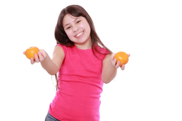 Cheerful Little Girl Holding Mandarins — Stock Photo, Image