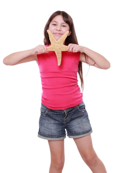 Girl holding big seastar — Stock Photo, Image