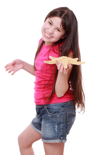 Girl holding big seastar — Stock Photo, Image