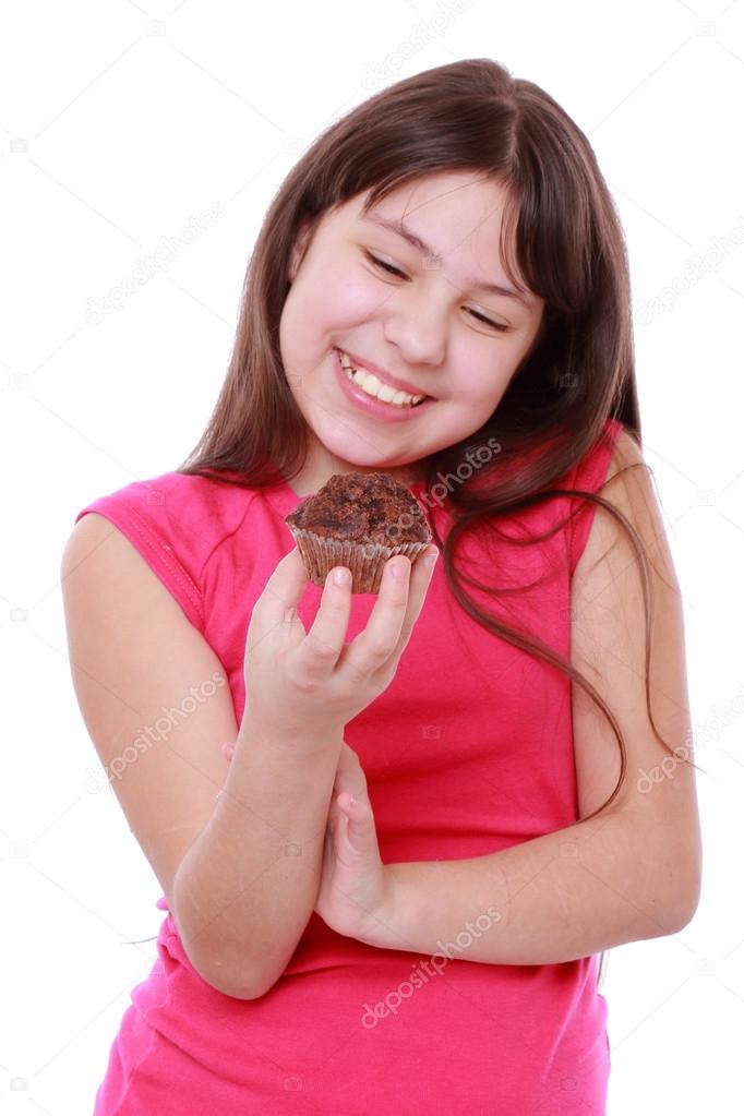 Girl holding cupcake