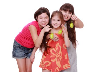 Girls holding eggs for Easter clipart