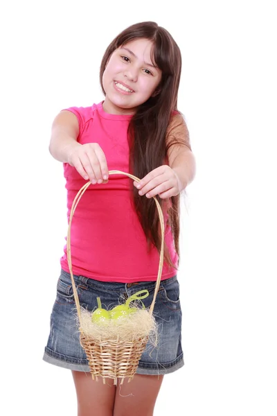 Girl holding basket with Easter eggs — Stock Photo, Image