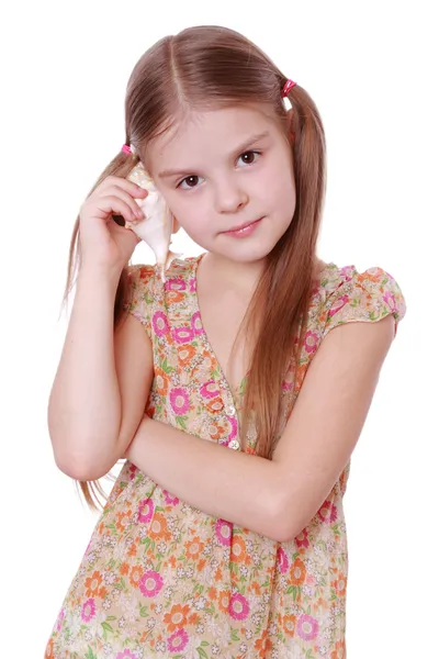 Girl holding sea shell — Stock Photo, Image