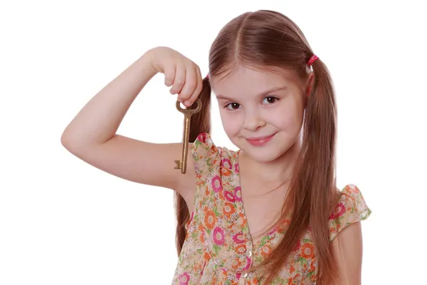 Meisje gouden vintage oude toets ingedrukt te houden — Stockfoto