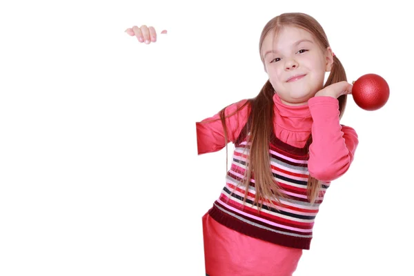 Girl holding christmas decoration — Stock Photo, Image