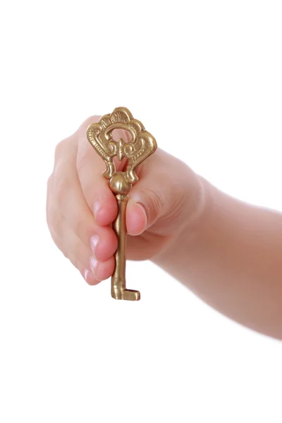 Girl holding vintage key — Stock Photo, Image