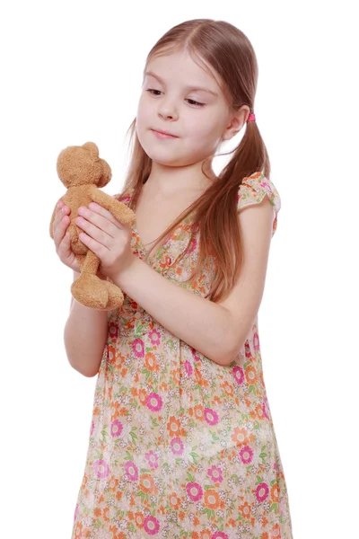 Girl with teddy bear Stock Image