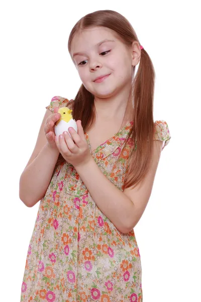 Girl holding a chicken egg Royalty Free Stock Images