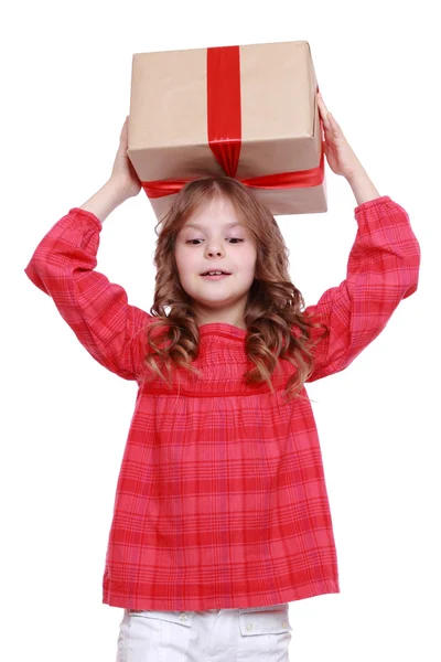 Lille pige holder en gave - Stock-foto