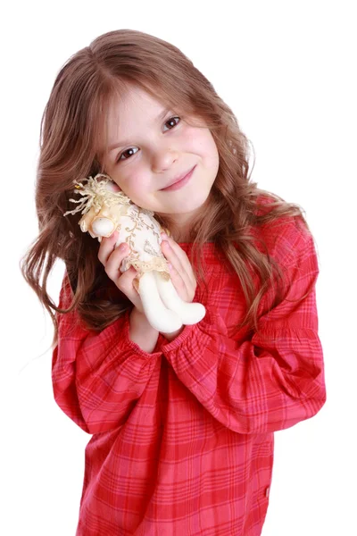 Маленькая девочка держит куклу ангела — стоковое фото